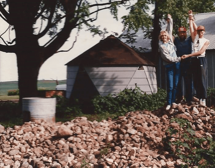 Me, Dad and my sister, Anne, on top of our rock pile, 1986.