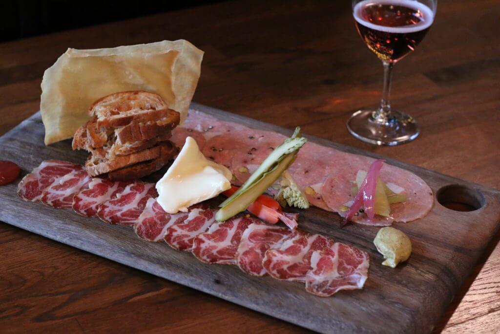 The Cold Cuts & Cheese selection featuring Coppa and Mortadella with house-made accoutrements.
