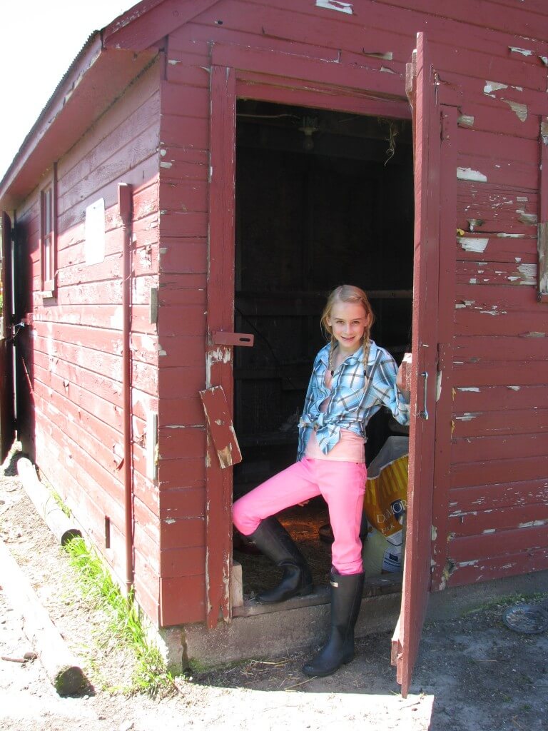 Sarah's daughter Sophia on the farm during planting season some years back.